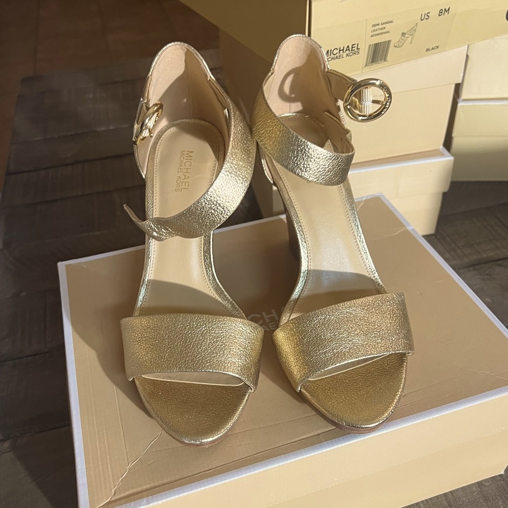 Michael Kors gold metallic wedge.